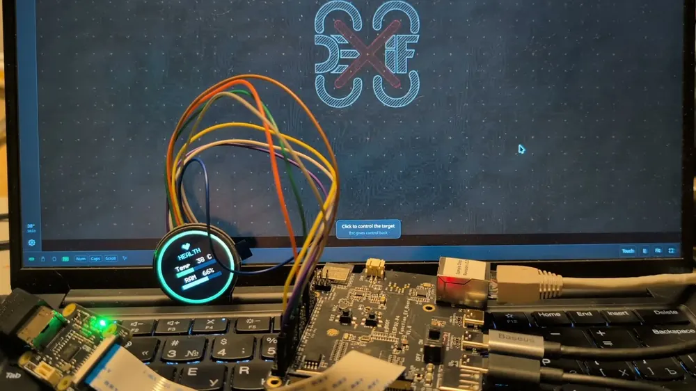 A frame from the clip: the round LCD on the bench, cycling its status pages.