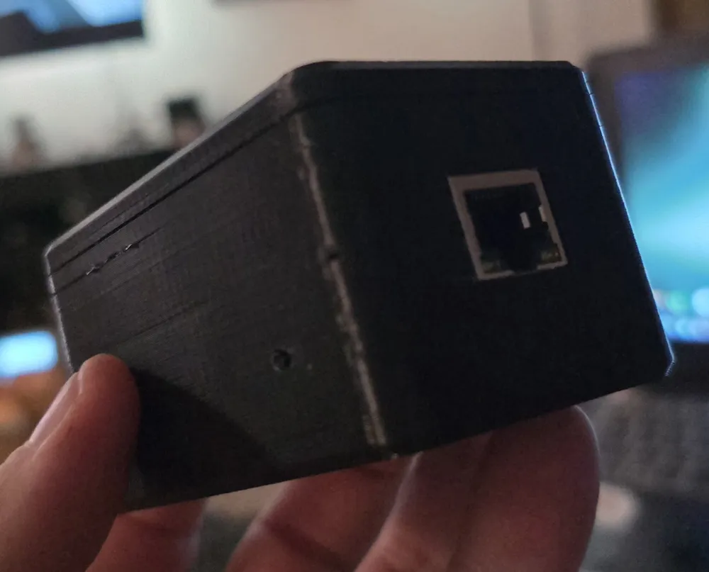 The Ethernet end, with a pinhole for the buttons on the side.