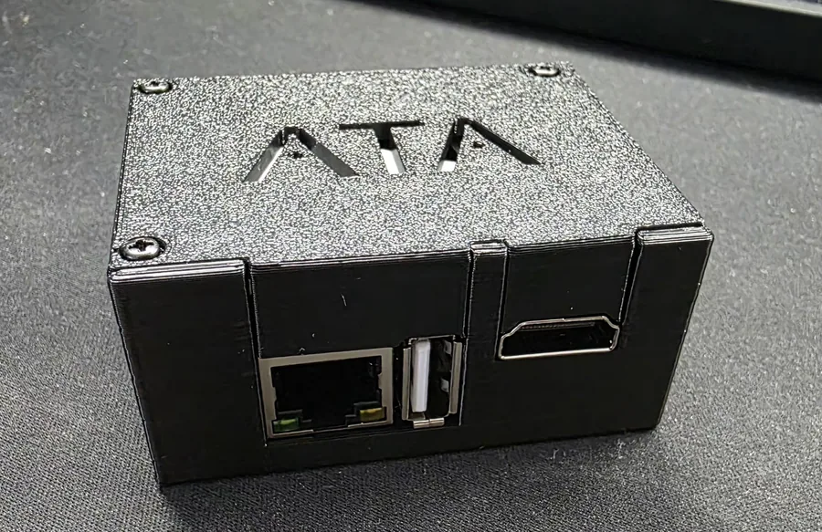 A small black 3D-printed case for the ESP32-P4-NANO and the C790, with Ethernet, USB and HDMI coming out of one end
