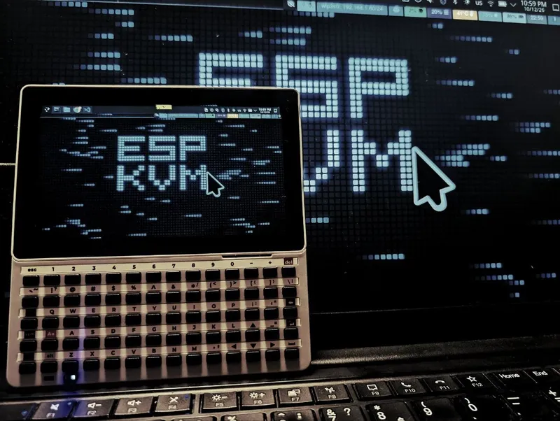 An M5Stack Tab5 with its keyboard showing the target's desktop, the same desktop on the laptop screen behind it.